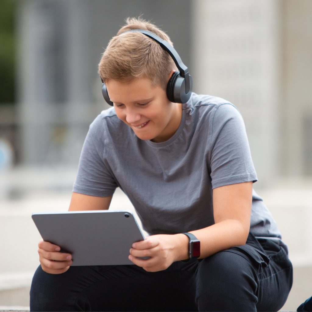 teen boy looking at tablet (1)